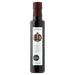 Bottle of Odyssea pomegranate molasses on a white background