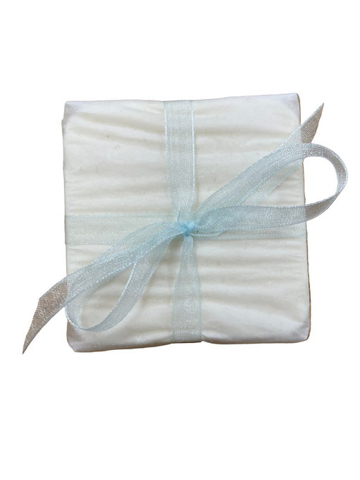 Goats milk soap wrapped in parchment paper