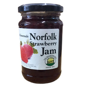 Jar of Norfolk Strawberry Jam with a label on a white background